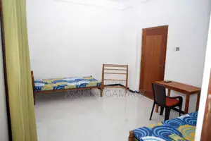 A Room With Two Beds. Small Kitchen. Attach Bathroom