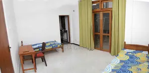 A Room With Two Beds. Small Kitchen. Attach Bathroom
