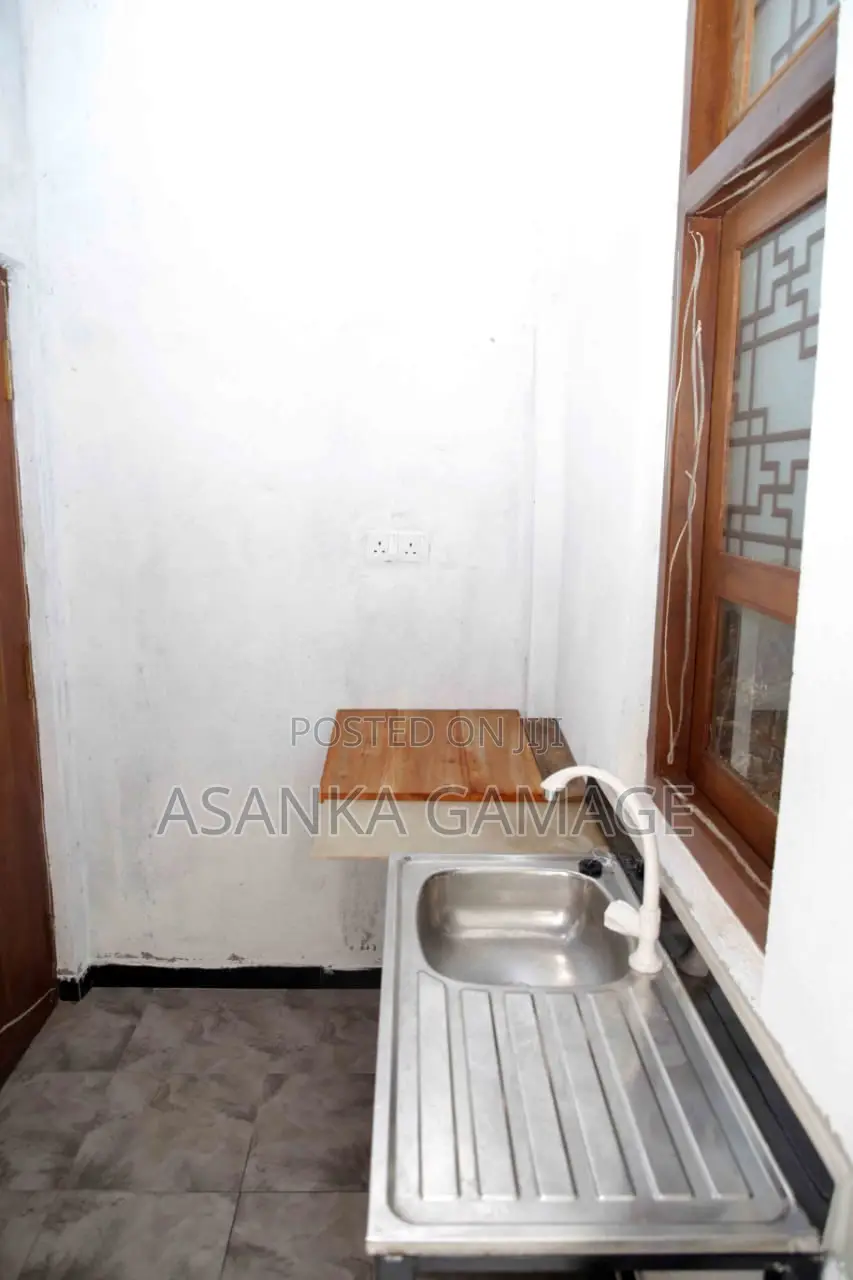 A Room With Two Beds. Small Kitchen. Attach Bathroom