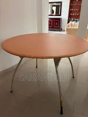 A Steel Table with 4 Cushion Chairs