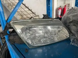 Nissan N16 Headlight (upper brkt dmg)