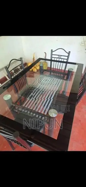 Glass table with four chairs