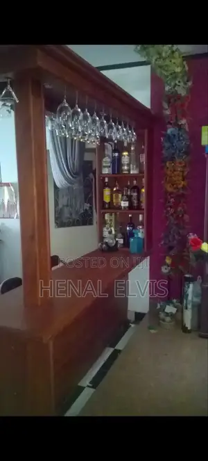 Teak Wooden Home Bar Counter With Overhead Glass Rack Shelves