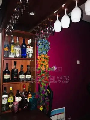 Teak Wooden Home Bar Counter With Overhead Glass Rack Shelves